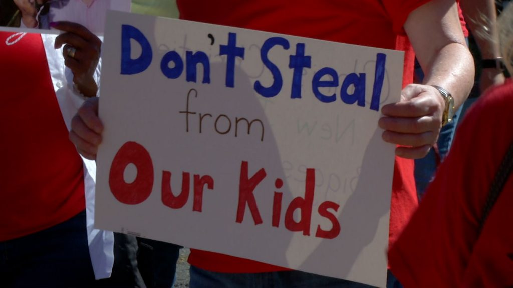 Protesters Greet Christie at Fairness Formula Forum in Bordentown
