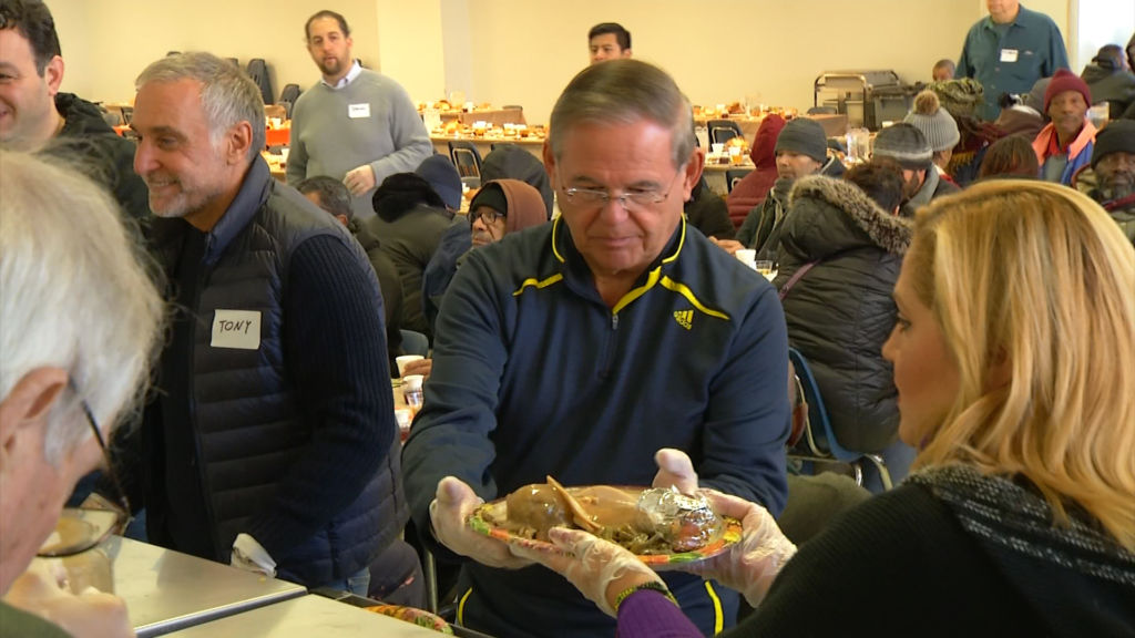 Politicians and volunteers serve up hot meals at Eva’s Village in Paterson