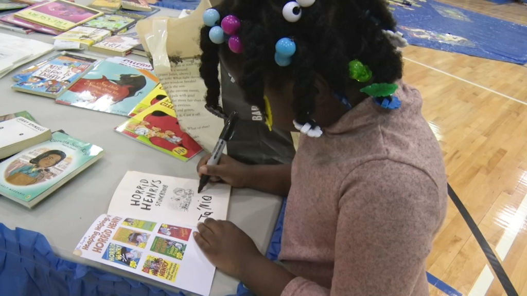 Trenton students receive free books in response to libraries closing in recent years
