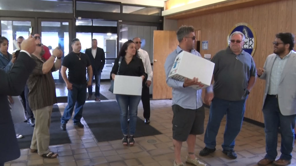 Edison residents deliver petition opposing plan to privatize water system