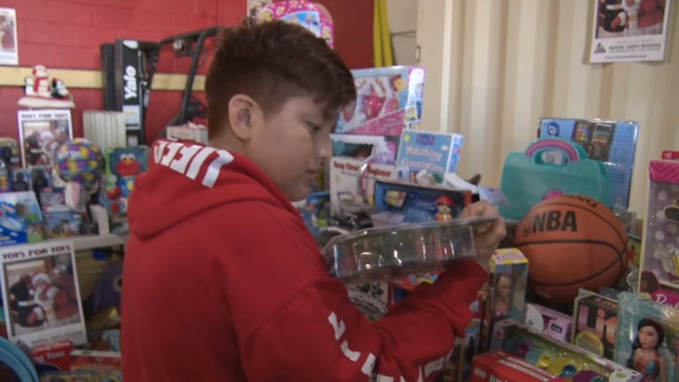 After traumatic events, kids and families find holiday cheer in toy giveaway