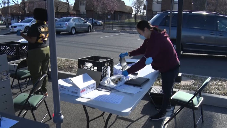Charter schools give out laptops so students can learn at home